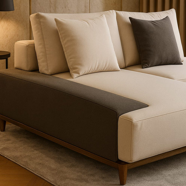 Beige sectional sofa with brown cushions in a living room setting.