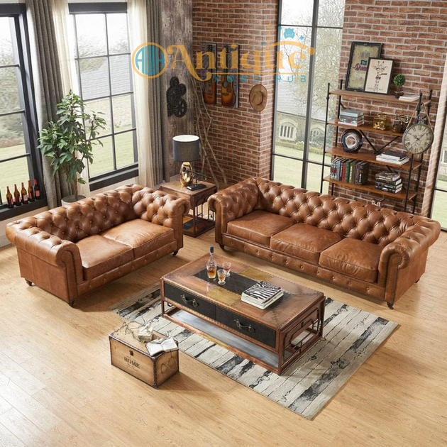 Brown leather sofa set in a living room with wooden coffee table and decorative items.