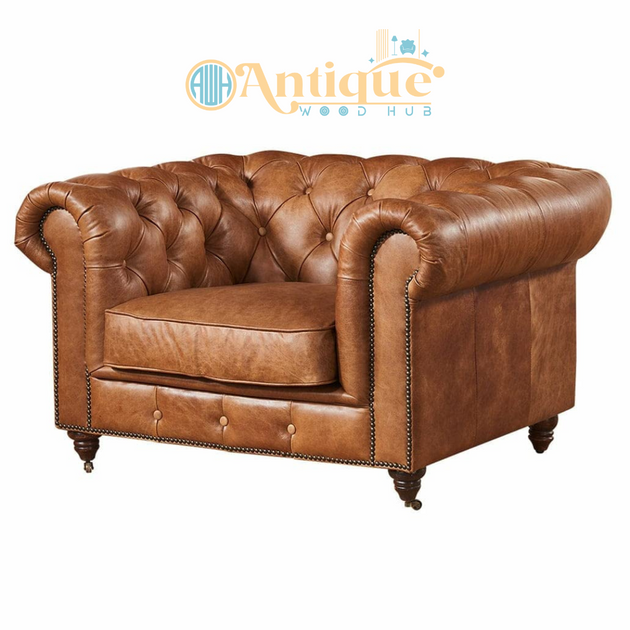 Brown leather armchair with tufted backrest on a white background, featuring the 'Antique Wood Hub' logo.