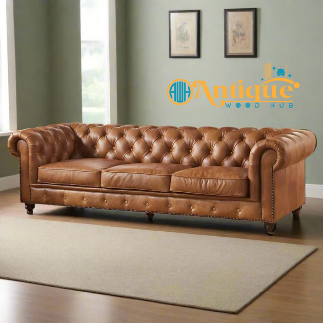Brown leather sofa in a room with a 'Antique Wood Hub' logo.