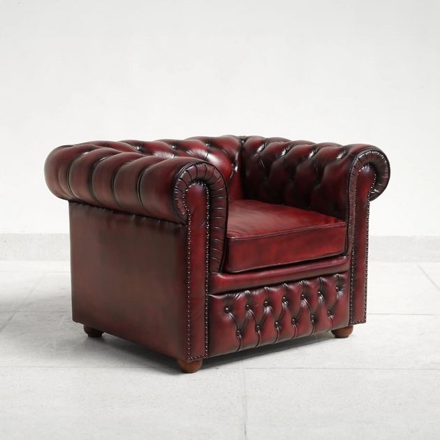 Red leather armchair on a white background