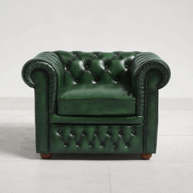Green leather armchair with tufted backrest on a light gray background