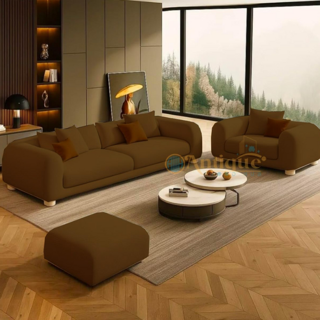 Modern living room with brown sofas, coffee table, and decorative items.