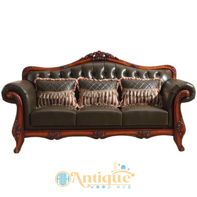 Brown leather sofa with decorative pillows on a white background, featuring the Antique Wood Hub logo.