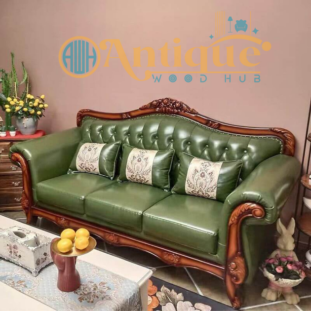Green leather sofa with wooden frame in a room setting, featuring 'Antique Wood Hub' logo.