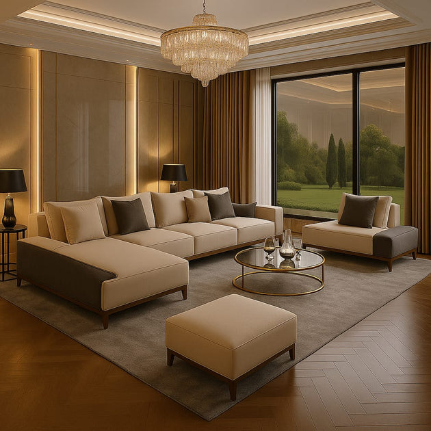 Modern living room with beige sofa, ottoman, and chandelier.