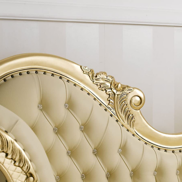 Close-up of a luxurious gold and beige headboard with intricate detailing.