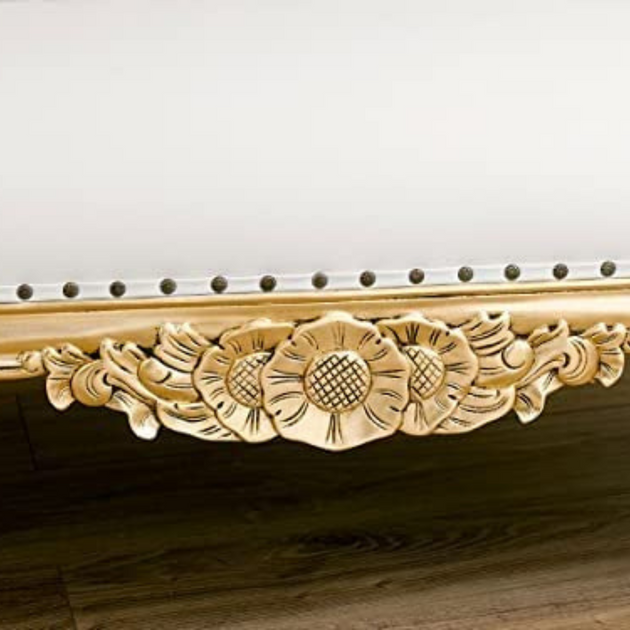 Decorative wooden cornice with floral patterns on a plain background