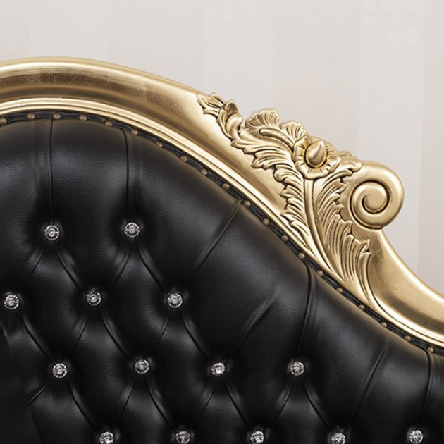 Black tufted headboard with gold frame and crystal accents on a light gray background