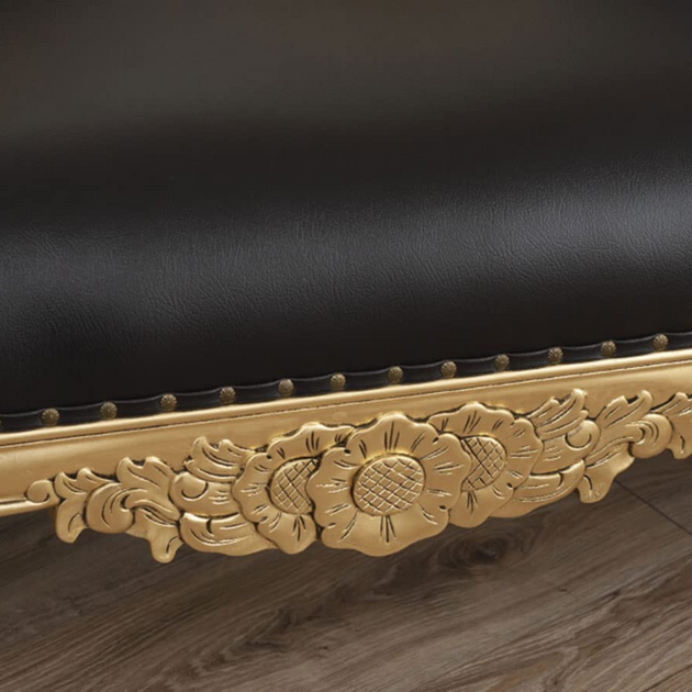 Decorative gold frame with floral patterns on a black background