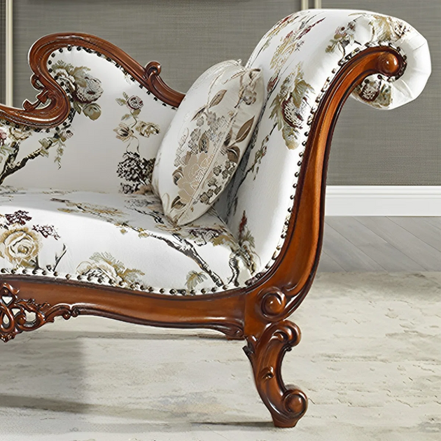 Decorative chair with floral pattern and wooden frame on a light background